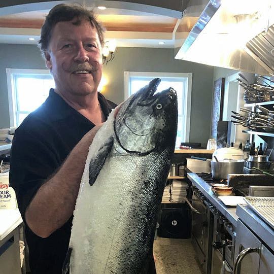 Scott Fraser holding a large salmon